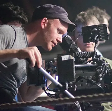 Topher Osborn, Director of Photography of Ouch!, standing on a film set