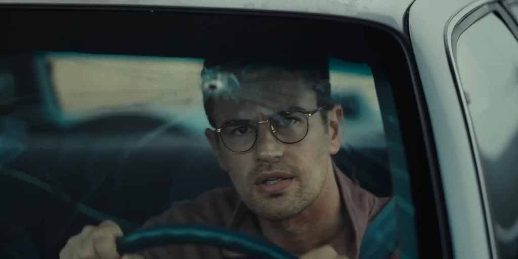 Theo James driving a car in THE MONKEY 