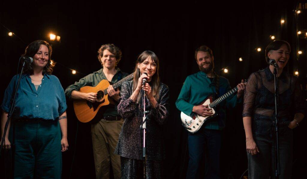 Cassidy Waring and her Band in a Promo Still for Hearse Chasing