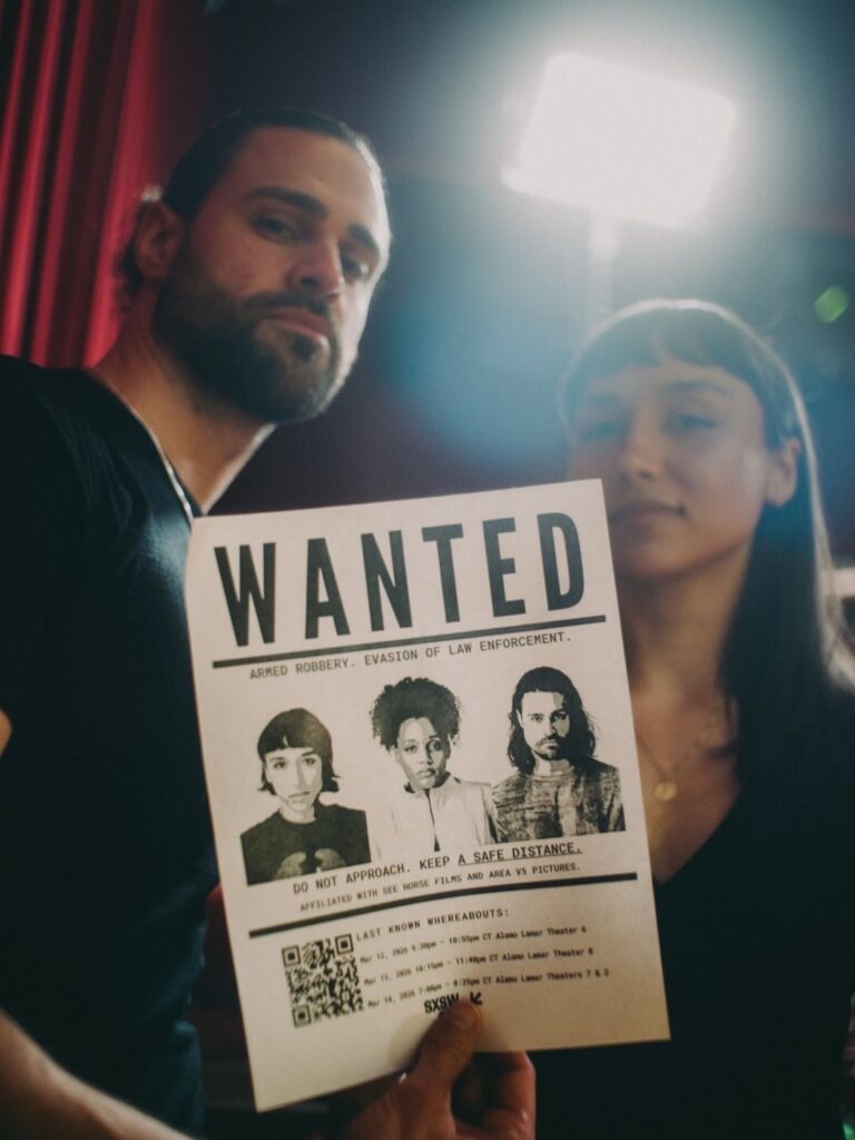 Cody Kearsley and Tandia Mercedes Holding a Poster for A Safe Distance at SXSW | @asafedistancefilm on Instagram