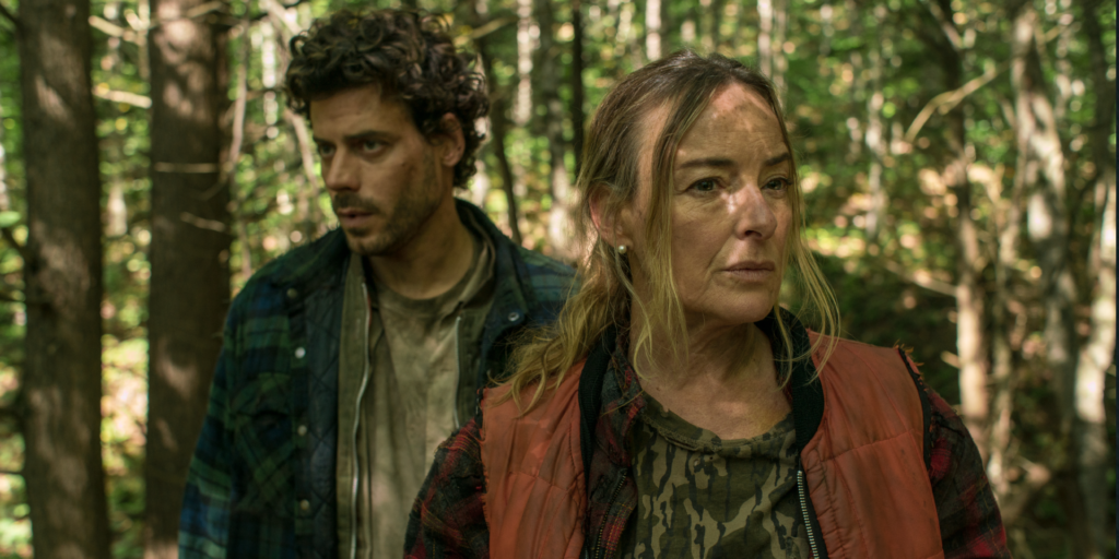 Pascale Bussières and François Arnaud standing in a forest in the film Someone's Daughter
