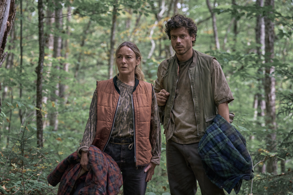 Pascale Bussières and François Arnaud standing in a forest in the film Someone's Daughter