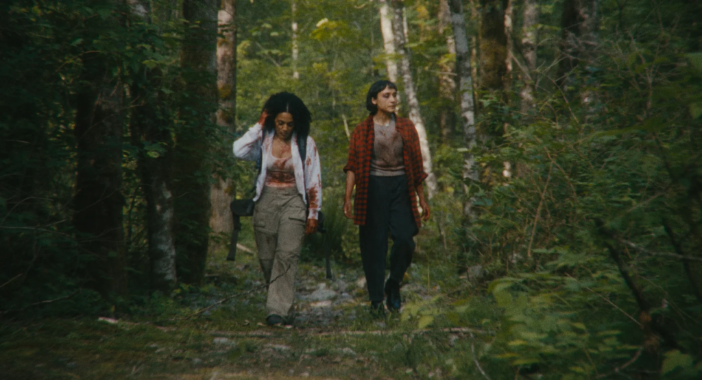 Two women walking through the British Columbia forest in A Safe Distance